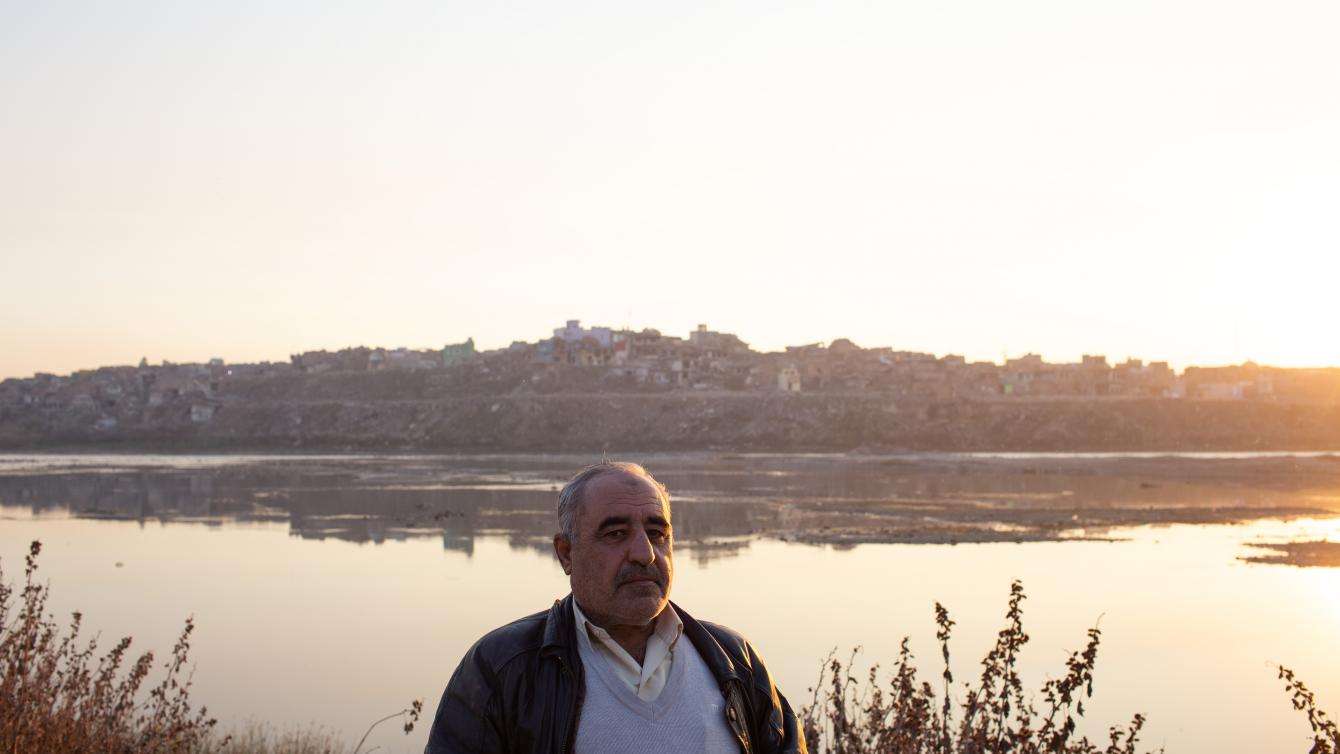 Man standing by the water