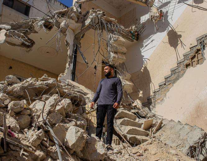 A Palestinian man stands in the rubble of his home after it was bulldozed by Israeli forces in Jenin refugee camp.