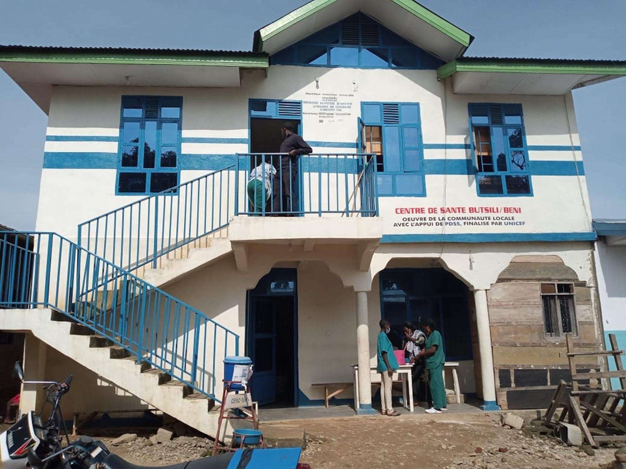 A two-story blue and white medical center