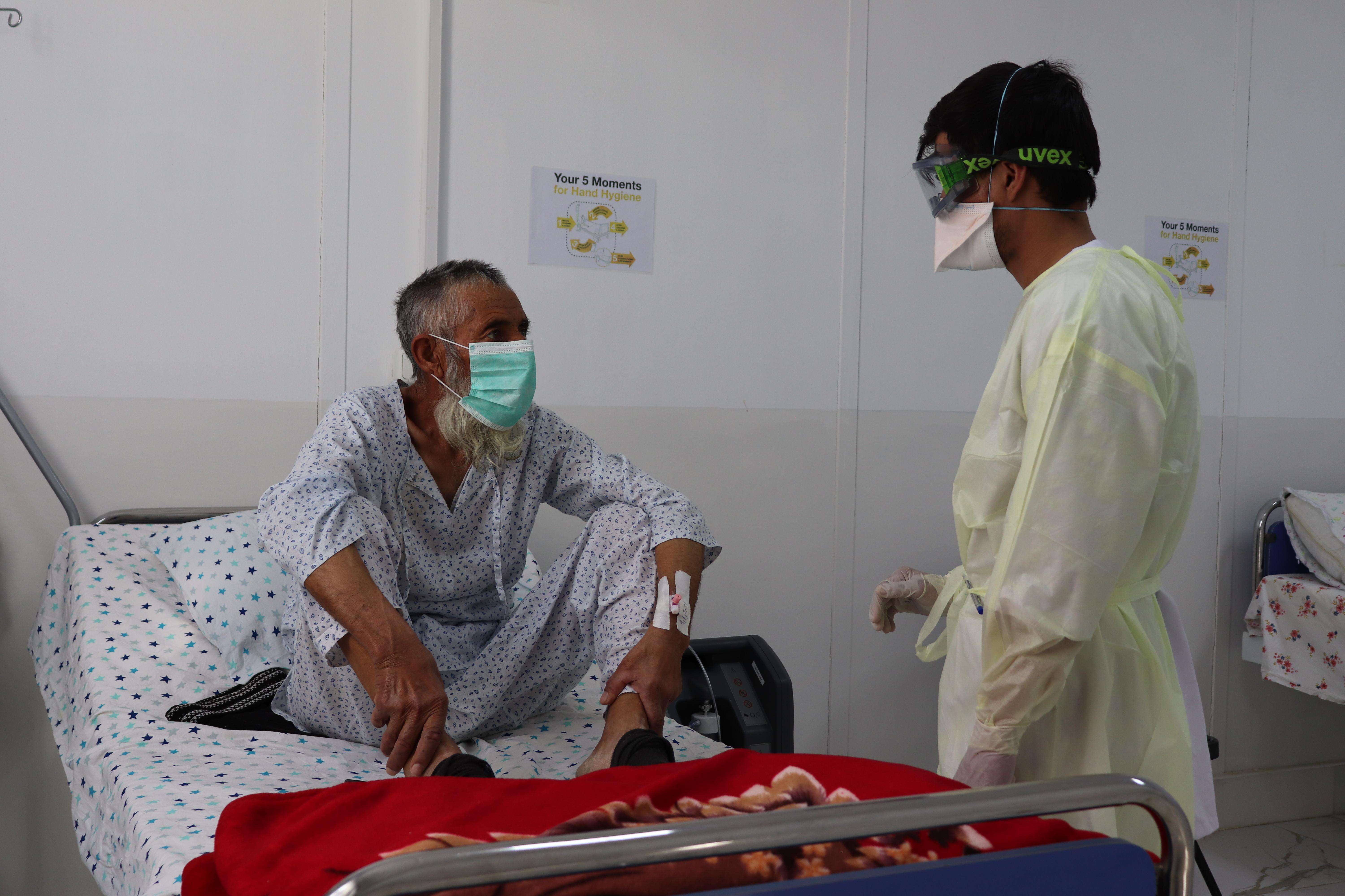 A medic speaks with a patient