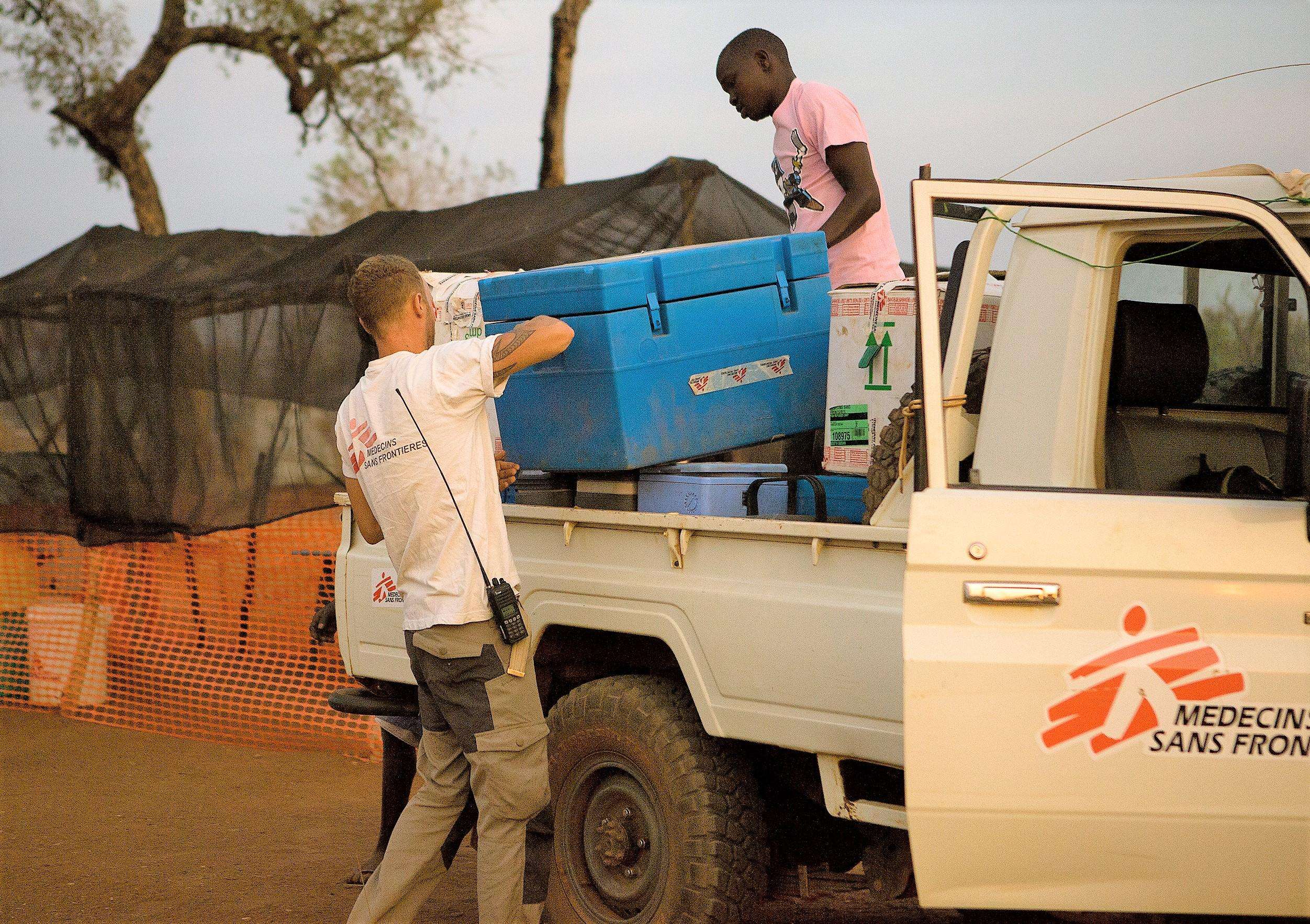 MSF Logisticians off-load vaccines at one of the vaccination sites.