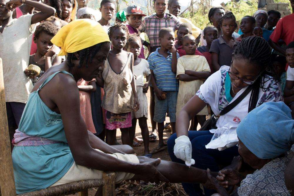 Cassandre Saint-Hubert MSF nurse (from Haiti) treats a patient at a Medecins Sans Frontieres (MSF) mobile clinic in the village of Nan Sevre, in the mountains north of Port-à-Piment.