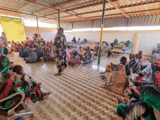 People waiting at Sayed Al Shuhada Hospital in Sudan.