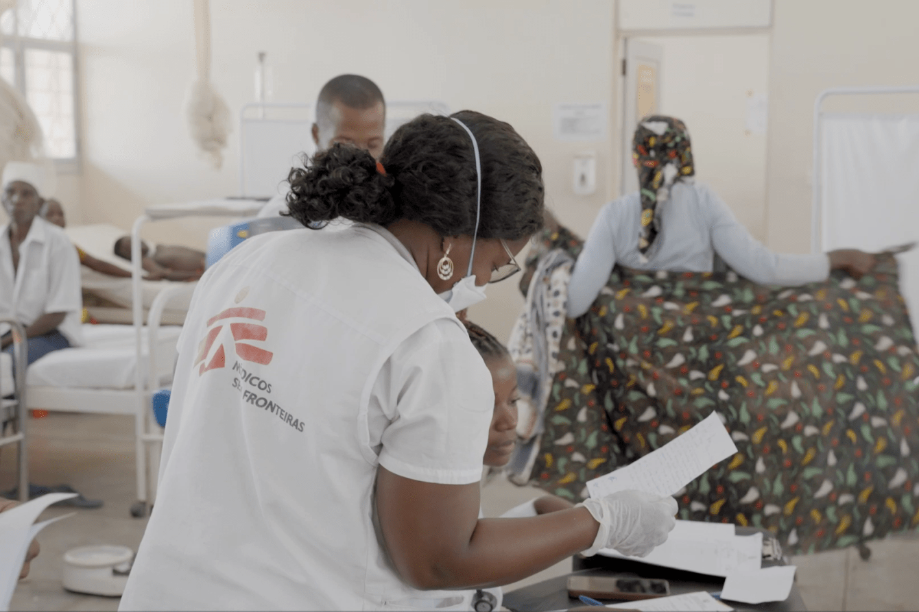 A doctor treats a patient in Mozambique