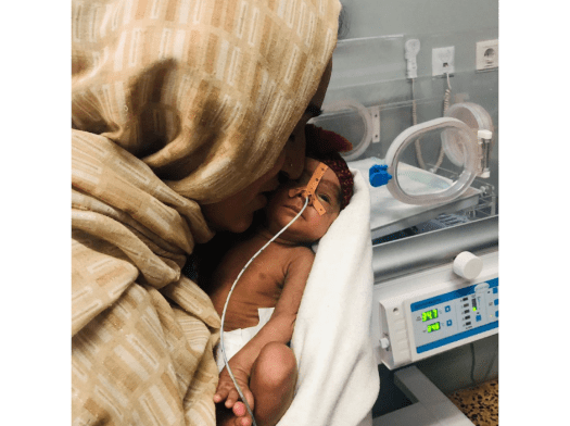 A mother holds her premature child at Mazar-i-Sharif Regional Hospital in Afghanistan.