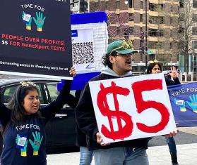 Protesters holding signs in Washington, DC as part of the Time for $5 campaign.