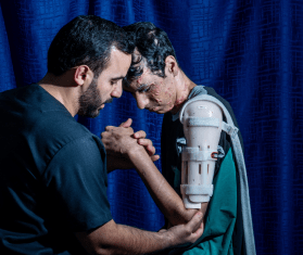 An injured Palestinian boy undergoes treatment from MSF in Jordan.